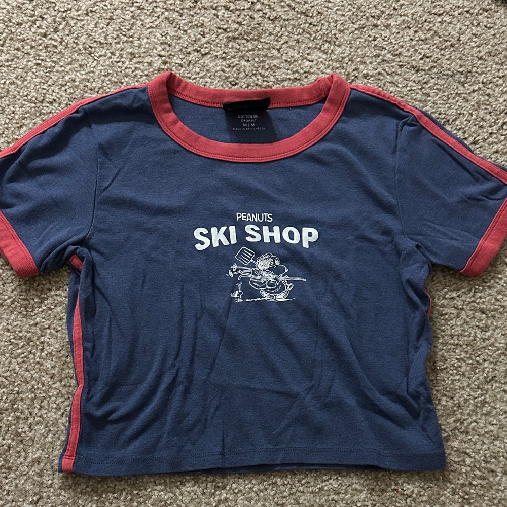 Peanuts Blue and Red Ski Shop Tee